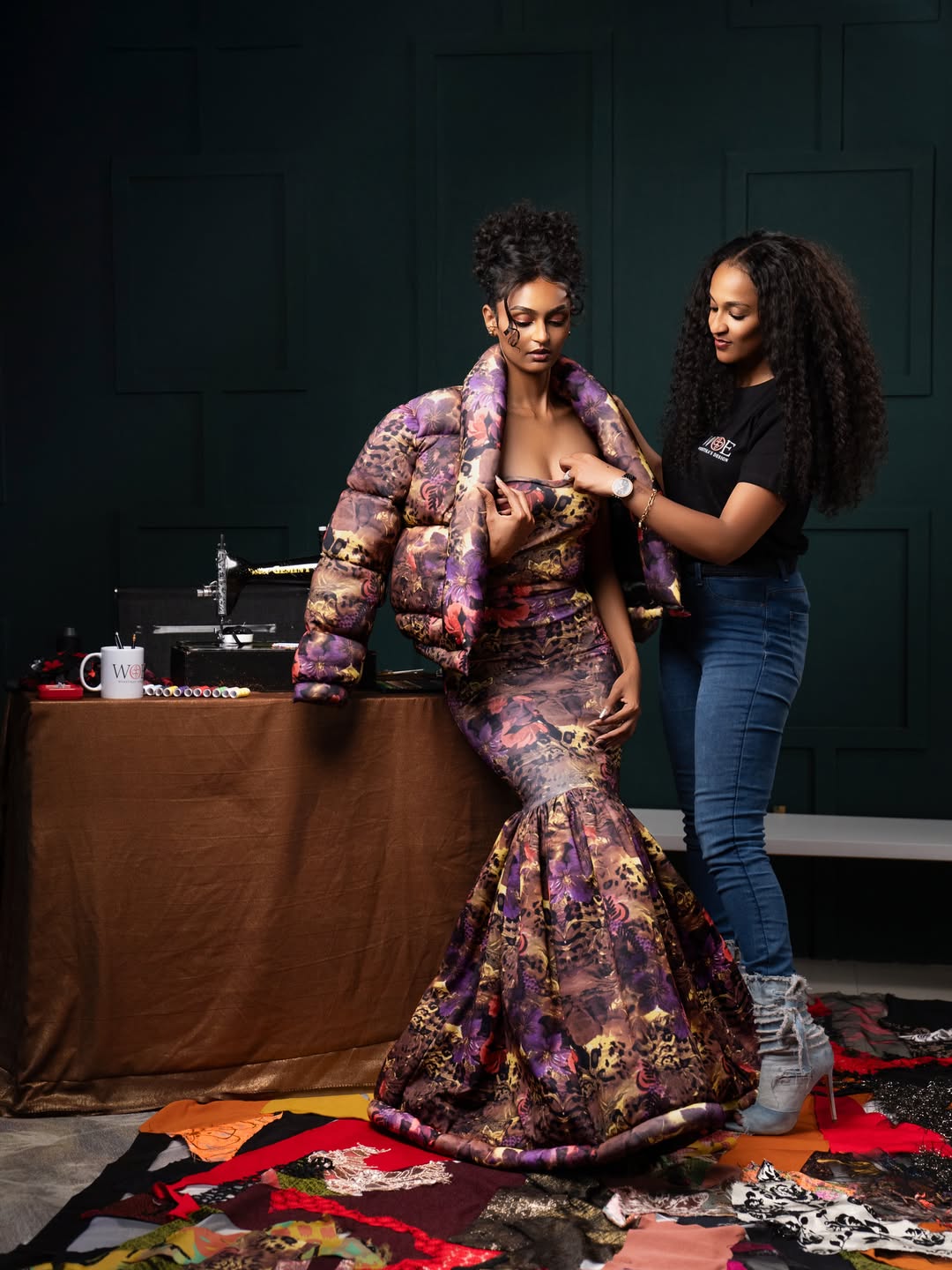 Selamawit dressing the model in the Sculptural gown